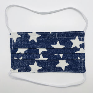 Masks are made of 2 layers 100% quilting cotton featuring a white stars on blue print, over the head elastic loops and a bendable aluminum nose. Wash in washing machine and dry in dryer after each use. 7” H x 7.5” W 