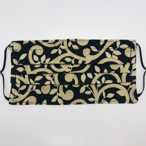 Masks are made of 2 layers of 100% quilting-weight gold swirls on black cotton fabric.  The elastic adjustable ear loops tightened with a  bead to make them comfortable to fit a wider range of sizes. The masks also have a bendable aluminum nose piece.  Machine wash and dry after each use.     7” H x 7.5” W