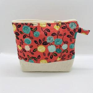The pouch is made from flowers on orange quilting cotton, an inner layer of fleece, essex/linen for the base and a cute metal tassel. The pouch design is from the Becca Bags pattern from Lazy Girl Design. Machine washable and dryable or air dry. 7.5W x 6”H x 2.5”D
