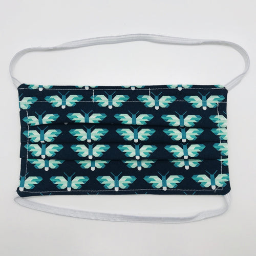 Masks are made of 2 layers of green and white butterflies on navy print 100% quilting cotton and have behind the head elastic bands. The masks also have a bendable aluminum nose. Wash in washing machine and dry in dryer after each use. 7” H x 7.5” W