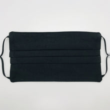 Load image into Gallery viewer, The masks are made of three layers of 100% quilting-weigh cotton fabric with a solid black front piece. This mask includes a filter pocket located in the pleats in the back of the mask for a filter of your choice and has adjustable elastic ear loops and a bendable aluminum nose piece. Machine wash and dry after each use. 7” H x 7.5” W

