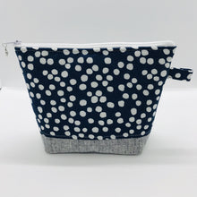 Load image into Gallery viewer, The pouch is made from 100% quilting cotton with a white dots on blue print, Kaufman Essex cotton/linen for the base, and a layer of fleece. The cute metal tassel gives an added touch. 7.5 W x 6”H x 2.5”D. Machine washable and dryer safe, or air dry.
