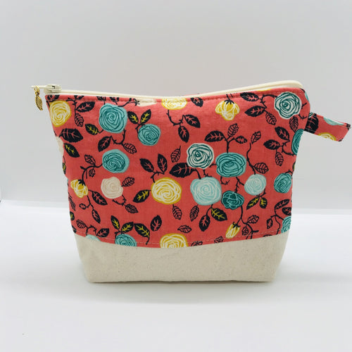 The pouch is made from flowers on orange quilting cotton, an inner layer of fleece, essex/linen for the base and a cute metal tassel. The pouch design is from the Becca Bags pattern from Lazy Girl Design. Machine washable and dryable or air dry. 7.5W x 6”H x 2.5”D