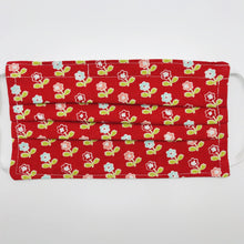 Load image into Gallery viewer, Made with three layers of vintage flowers on red  100% quilting-weigh cotton fabric. This mask includes a filter pocket located in the pleats in the back of the mask for a filter of your choice. Available with either elastic head bands or adjustable elastic ear loops and also has a bendable aluminum nose piece which helps to make a better seal over the wearers face. Machine  wash and dry after each use. 7” H x 7.5” W
