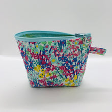 Load image into Gallery viewer, The small pouch is made from 100% cotton spring flowers print and has a layer of fleece for structure and a cute metal tassel. The pouch design is from the Becca Bags pattern from Lazy Girl Design. 6”W x 4.5” H x 1”D. Machine washable and dryer safe or air dry.

