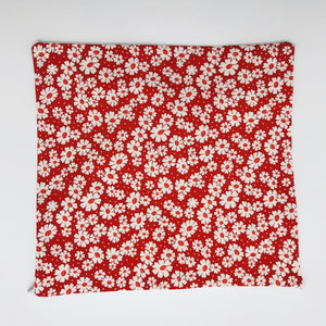 Image of 30's retro simple daisy's on red fabric print.