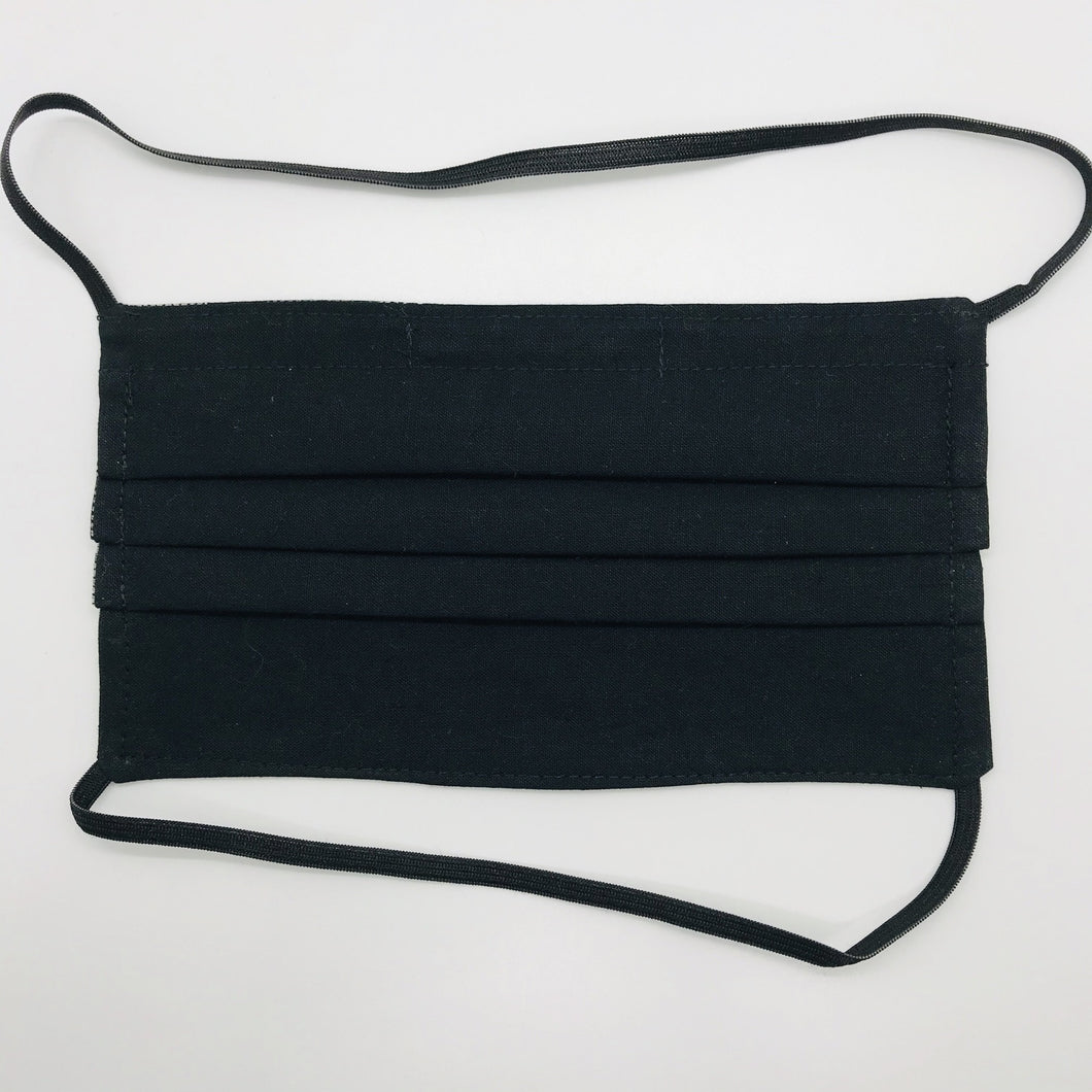 Masks are made of 2 layers of 100% quilting-weight featuring solid black cotton and have behind the head elastic bands. The masks also have a bendable aluminum nose piece. Wash in washing machine and dry in dryer after each use. 7” H x 7.5” W