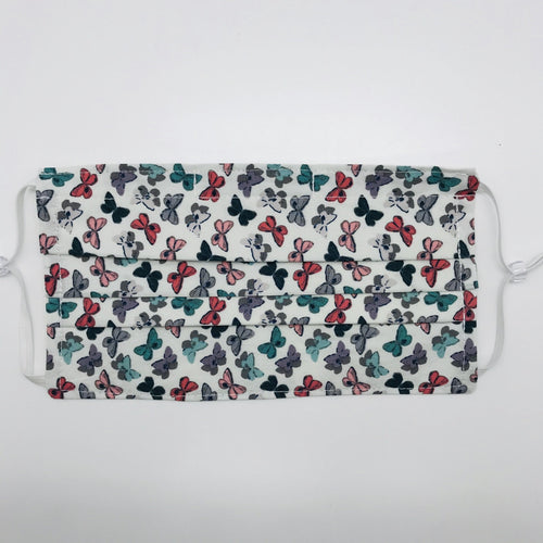 Masks are made of 2 layers of 100% quilting cotton and feature a butterfly print by Art Gallery Fabrics. The mask has elastic adjustable ear loops and a bendable aluminum nose piece.  Machine wash and dry after each use. 7” H x 7.5” W
