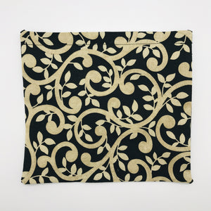 Image of gold swirls on black fabric