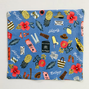 100% quilting-weight blue travel themed cotton face mask with elastic bands and bendable nose piece. Washable, reusable fabric face mask. Wash in washing machine and dry in dryer after each use.  Fabric from the Les Fleurs collection by Rifle Paper co, designed by Ann Rifle Bond.  7” H x 7.5” W