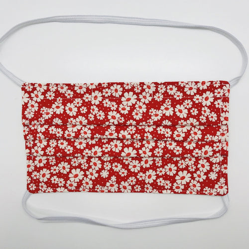 Masks are made of 2 layers of 100% quilting-weight cotton with a 30's retro simple daisy red fabric print  and have behind the head elastic bands. The masks also have a bendable aluminum nose piece which helps to make a better seal over the wearers face. Wash in washing machine and dry in dryer after each use. 7” H x 7.5” W