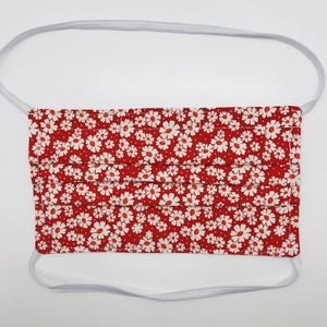 Masks are made of 2 layers of 100% quilting-weight cotton with a 30's retro simple daisy red fabric print  and have behind the head elastic bands. The masks also have a bendable aluminum nose piece which helps to make a better seal over the wearers face. Wash in washing machine and dry in dryer after each use. 7” H x 7.5” W