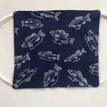 Load image into Gallery viewer, 100% quilting-weight cotton blue background with white fish face mask with behind the head elastic bands  and bendable nose piece. Washable, reusable fabric face mask. Wash in washing machine and dry in dryer after each use. 7” H x 7.5” W
