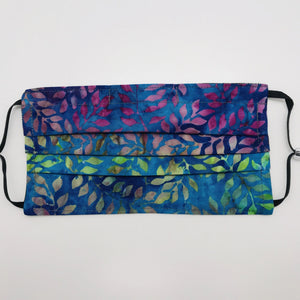 Masks are made of 2 layers of 100% quilting-weight batik cotton of blue, green and purples leaves. The masks have elastic adjustable ear loops and a bendable aluminum nose piece. Machine wash and dry after each use. 7” H x 7.5” W