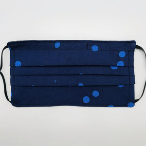 Masks are made of 2 layers of 100% quilting-weight medium blue dot on dark blue batik cotton. The mask has elastic adjustable ear loops and a bendable aluminum nose piece which helps to make a better seal over the wearers face. Machine wash and dry after each use.  7” H x 7.5” W